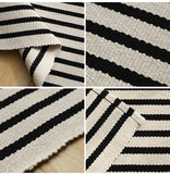 Black and Ivory Striped Layering Rug
